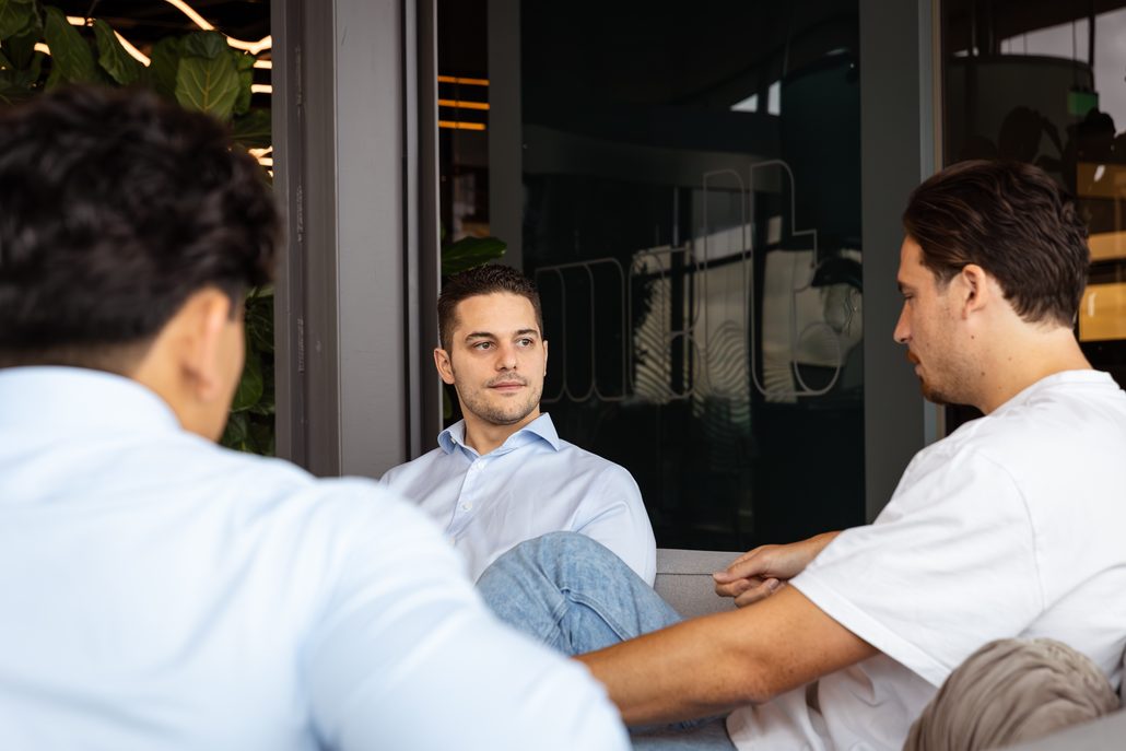 Two consultants talking across a table